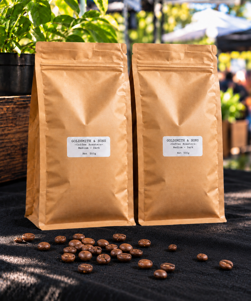 Two Goldsmith & Sons Signature Blend 500g whole bean coffee bags with roasted coffee beans. Copy